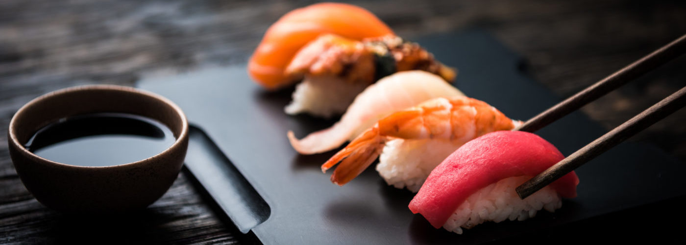close up of sashimi sushi set with chopsticks and soy close up of sashimi sushi set with chopsticks and soy